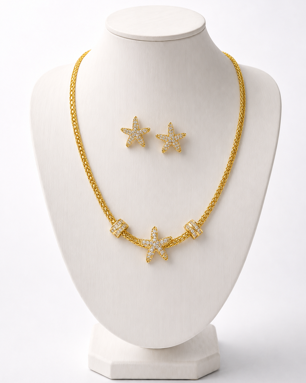 Conjunto de colar e brinco com pingentes de estrelas, tom dourado