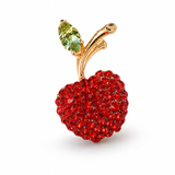 Broche de cereja com strass vermelhos, folha verde e haste dourada em arco