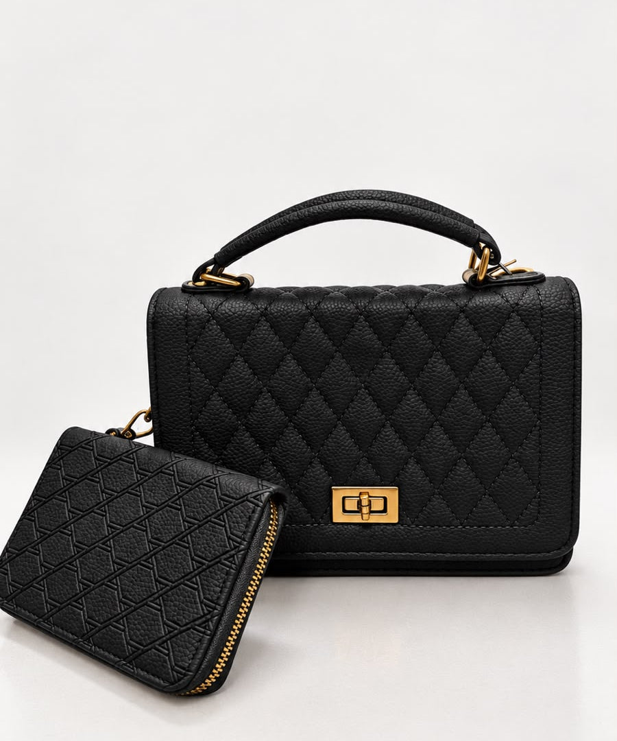 Bolsa preta com acabamento matelassê, alça superior e fecho dourado; acompanha carteira.