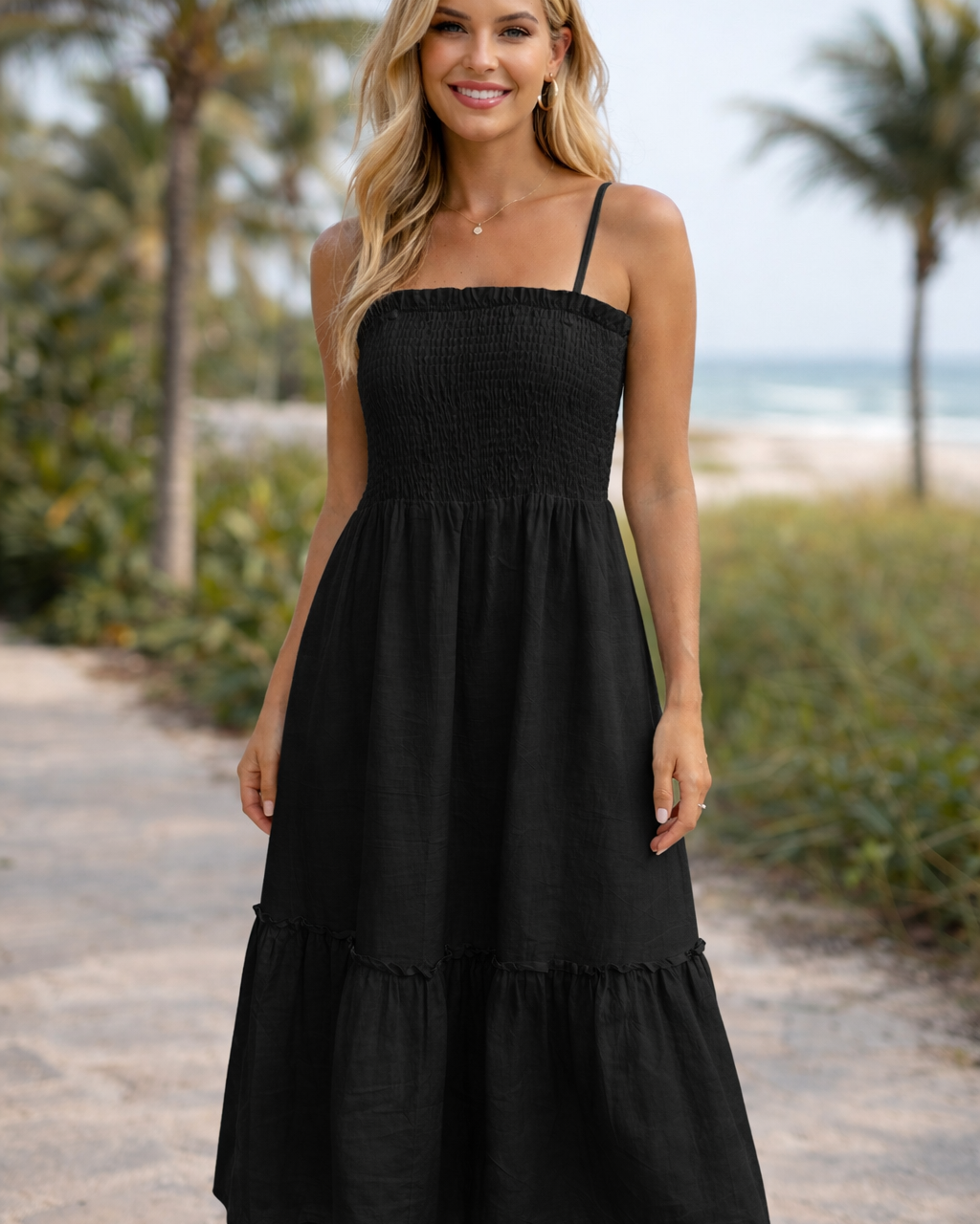 Vestido midi preto de alças finas, manguinha franzida no busto e saia rodada