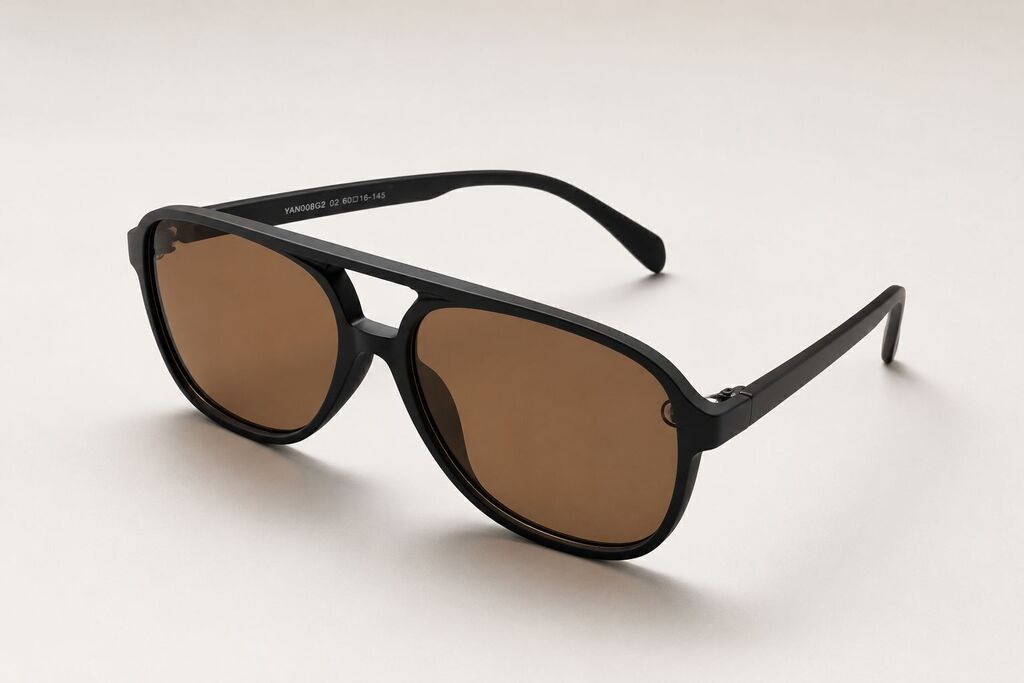 Óculos Emma com armação preta e lentes marrom-escuro estilo aviador