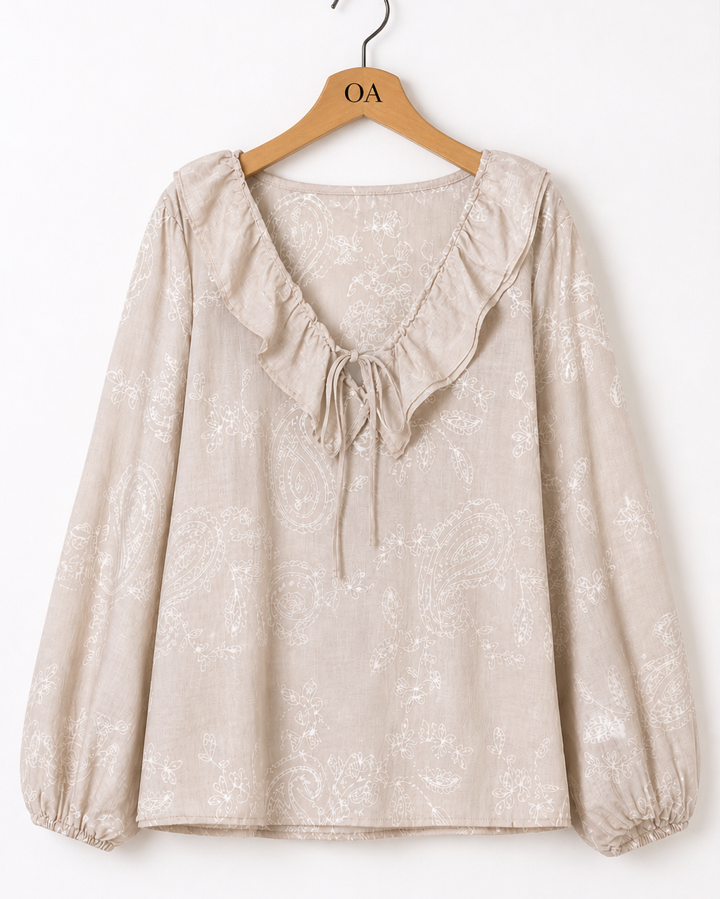 Blusa bege com mangas bufantes e cordão no decote V