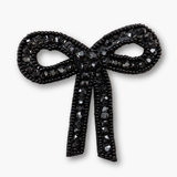 Broche em forma de laço com strass preto