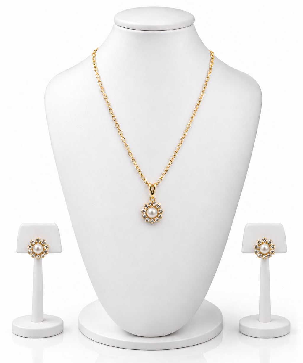 Conjunto lila: colar dourado com pingente floral e brincos combinando