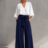 Calça azul-marinho pantalona com cós alto e laço frontal