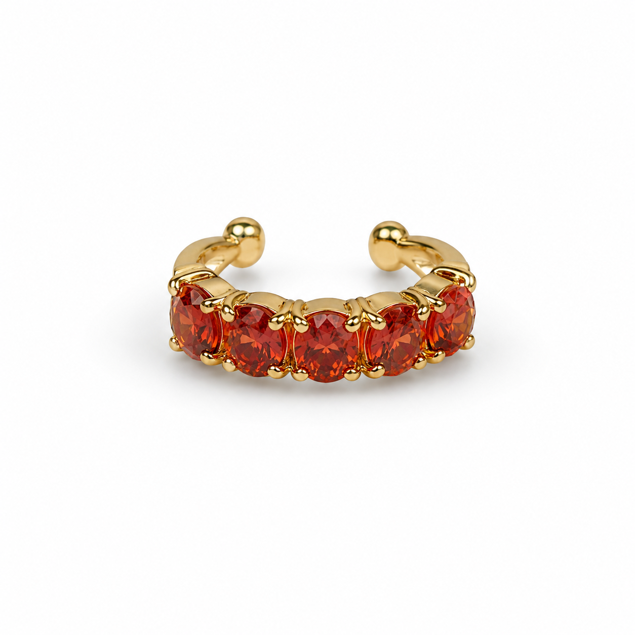 Piercing de argola dourada com pedras vermelhas
