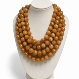 Colar maxi de pérolas marrom-douradas esféricas, em camadas