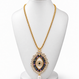 Colar dourado com corrente e pingente olho azul com strass e pérola pendente