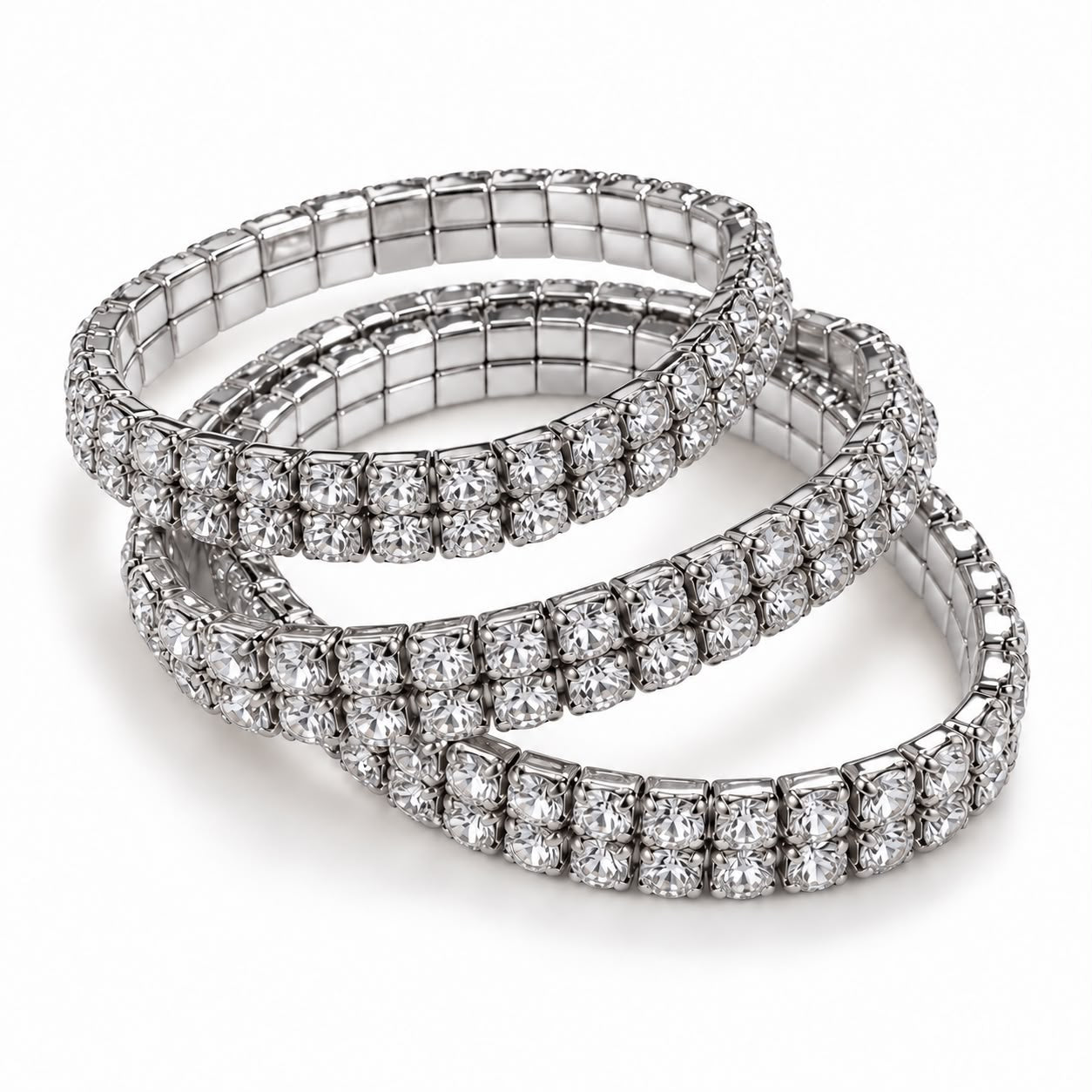 Trio de pulseiras de strass prateadas, formato tipo tennis, com fecho discreto