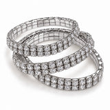 Trio de pulseiras de strass prateadas, formato tipo tennis, com fecho discreto