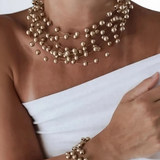 Colar dourado de esferas em camadas, com pulseira a jogo