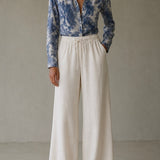 Calça Maria Claudia de cintura elástica, pernas largas, cor creme