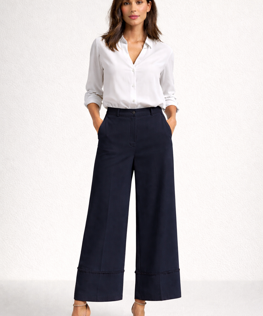 Calça Trancoso azul-marinho pantalona de cintura alta, pespontos na barra