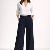 Calça Trancoso azul-marinho pantalona de cintura alta, pespontos na barra