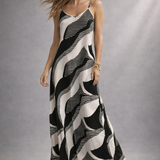 Vestido longo estampado preto e branco, alças finas e decote V com saia ampla