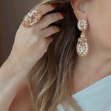 Anel Mila dourado com pedra brilhante oval e microcristais